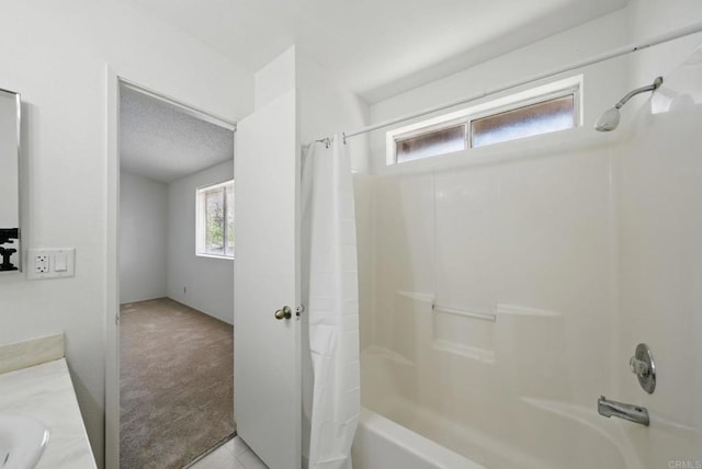 full bath featuring a sink, tile patterned flooring, and shower / bath combo
