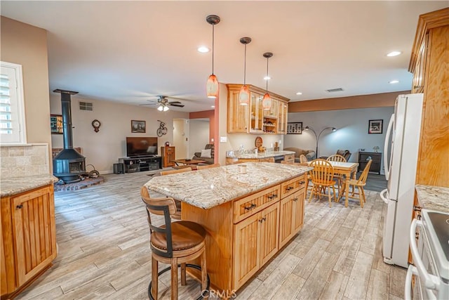 2650 Belburn Pl, Simi Valley, CA 93065 - kitchen featuring freestanding refrigerator, ceiling fan, light wood-style flooring, open floor plan, and light stone countertops