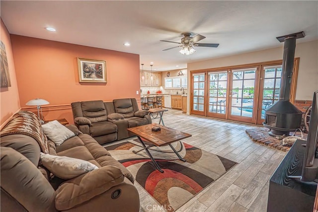 2650 Belburn Pl, Simi Valley, CA 93065 - living room with a wood stove, ceiling fan, light wood-style floors, and recessed lighting