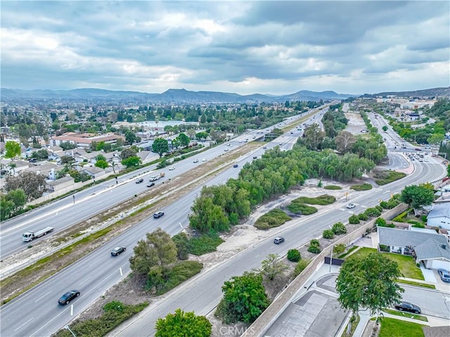 2650 Belburn Pl, Simi Valley, CA 93065 - aerial perspective of suburban area with a major roadway and a mountain backdrop