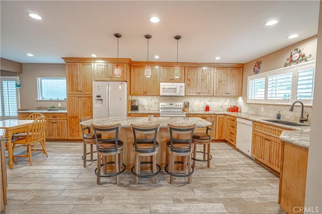 2650 Belburn Pl, Simi Valley, CA 93065 - kitchen featuring white appliances, healthy amount of natural light, recessed lighting, light wood-style floors, and tasteful backsplash