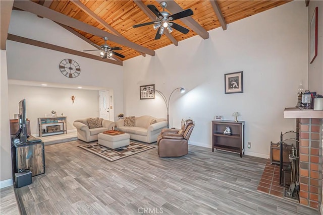 2650 Belburn Pl, Simi Valley, CA 93065 - living area featuring wooden ceiling, a ceiling fan, a fireplace, beamed ceiling, and baseboards