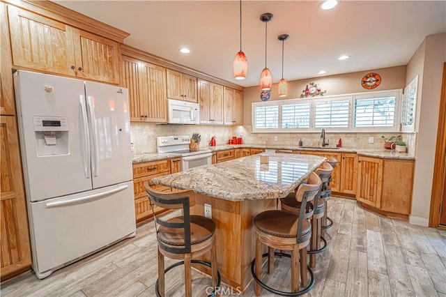 2650 Belburn Pl, Simi Valley, CA 93065 - kitchen with white appliances, a sink, backsplash, a kitchen island, and light wood finished floors