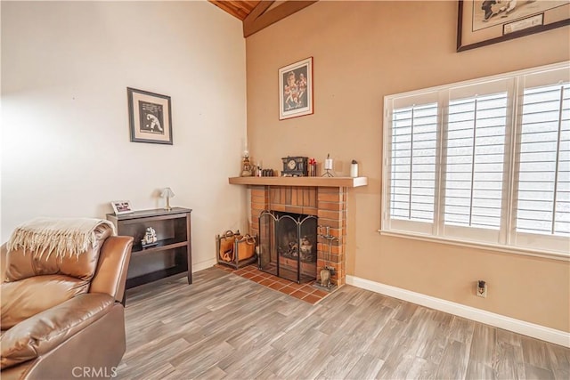 2650 Belburn Pl, Simi Valley, CA 93065 - living area featuring wood finished floors, a brick fireplace, baseboards, high vaulted ceiling, and beam ceiling