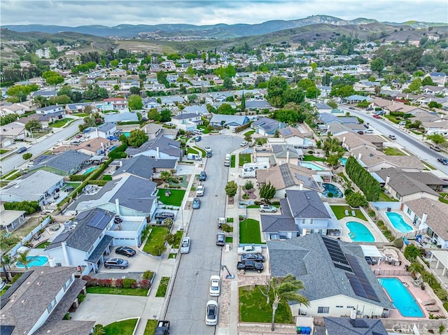 2650 Belburn Pl, Simi Valley, CA 93065 - aerial overview of property's location featuring a pool, mountains, and nearby suburban area