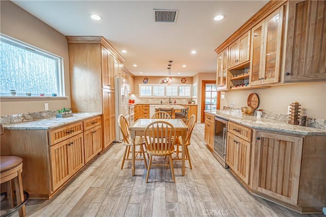 2650 Belburn Pl, Simi Valley, CA 93065 - kitchen featuring beverage cooler, light wood-style floors, white fridge with ice dispenser, recessed lighting, and hanging light fixtures