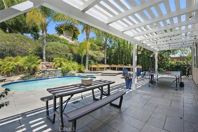 pool with a patio, a pergola, an in ground hot tub, and a fenced backyard