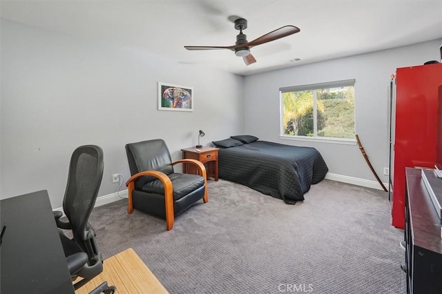 bedroom featuring carpet flooring, a ceiling fan, and baseboards