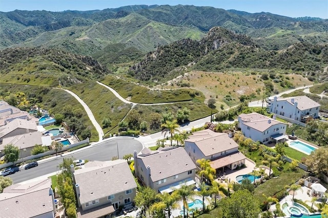 drone / aerial view featuring a mountain view and a residential view