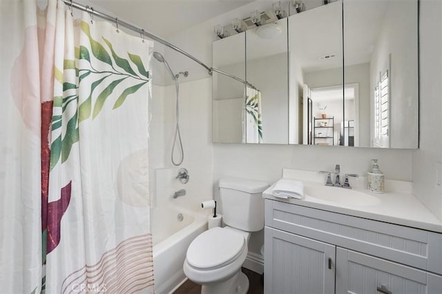 full bath with toilet, shower / tub combo, and vanity