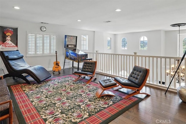 sitting room with recessed lighting, wood finished floors, and visible vents