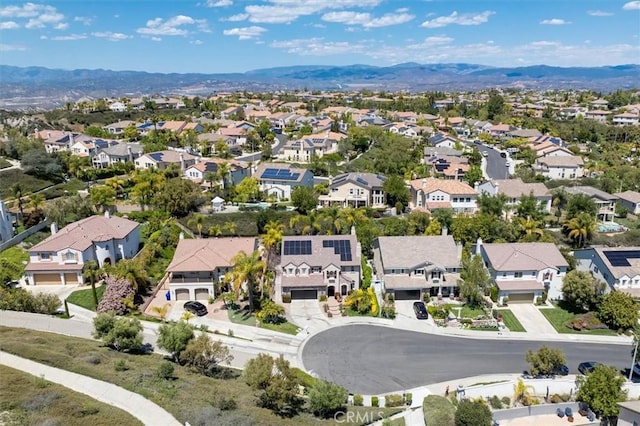birds eye view of property with a mountain view and a residential view