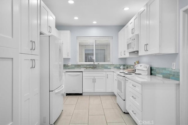 5216 Yarmouth Ave Unit 106, Encino, CA 91316 - kitchen featuring a sink, white cabinetry, white appliances, and light countertops