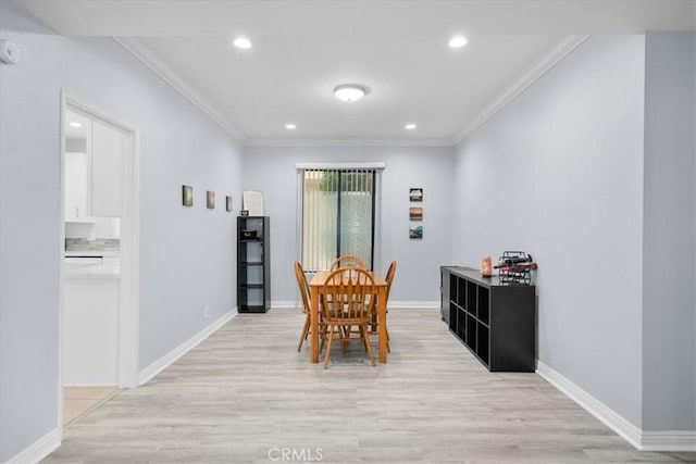 5216 Yarmouth Ave Unit 106, Encino, CA 91316 - dining space featuring light wood-style floors, baseboards, and ornamental molding