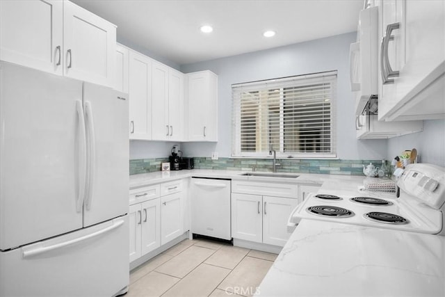 5216 Yarmouth Ave Unit 106, Encino, CA 91316 - kitchen featuring white appliances, white cabinetry, light stone countertops, and a sink
