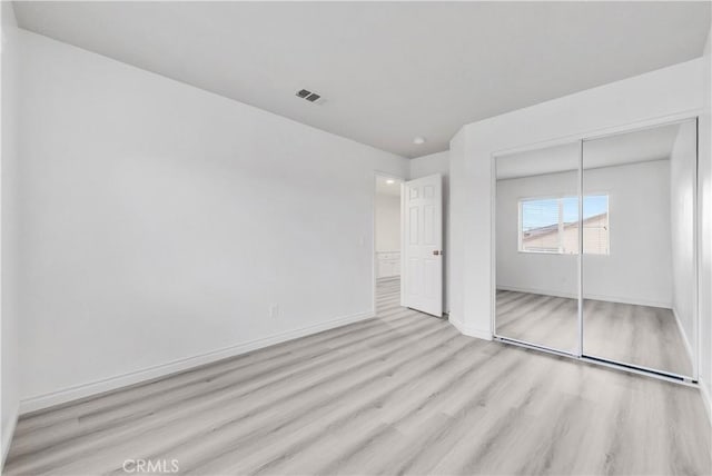 9058 Chimney Rock Ave, Hesperia, CA 92344 - unfurnished bedroom featuring baseboards, a closet, visible vents, and wood finished floors