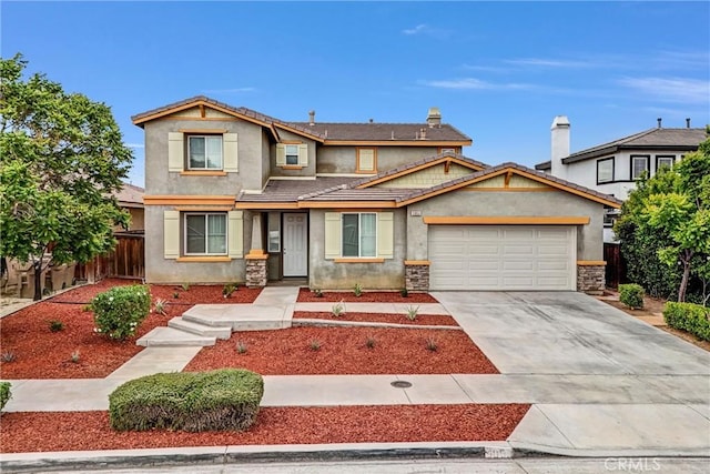 9058 Chimney Rock Ave, Hesperia, CA 92344 - traditional-style house with fence, stone siding, driveway, a garage, and stucco siding
