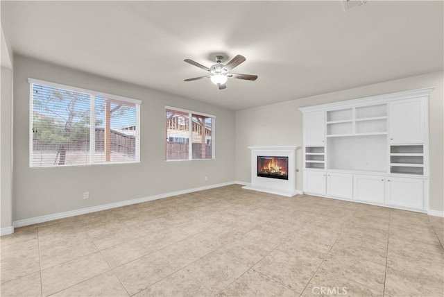 9058 Chimney Rock Ave, Hesperia, CA 92344 - unfurnished living room featuring a ceiling fan, baseboards, a glass covered fireplace, and light tile patterned floors