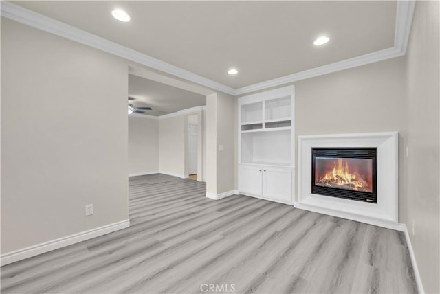9058 Chimney Rock Ave, Hesperia, CA 92344 - unfurnished living room with crown molding, light wood-style floors, and baseboards