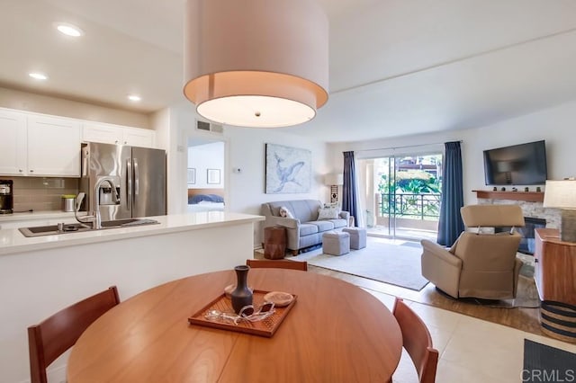 dining room featuring recessed lighting, visible vents, and light tile patterned floors