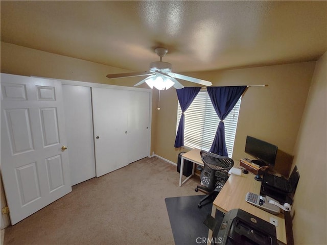 office space featuring carpet and a ceiling fan
