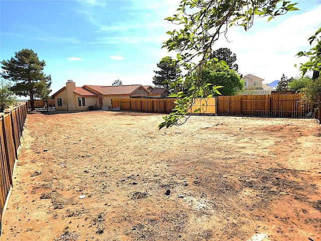 view of yard featuring a fenced backyard