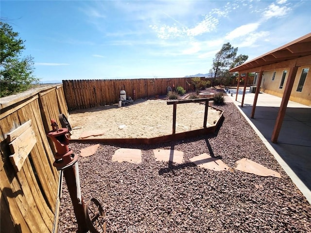 view of yard featuring a patio and a fenced backyard
