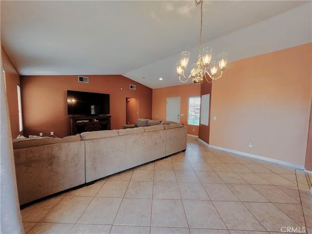 living area featuring lofted ceiling, visible vents, an inviting chandelier, light tile patterned floors, and baseboards
