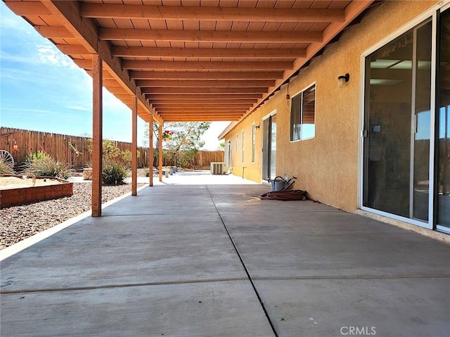 view of patio with central air condition unit and a fenced backyard
