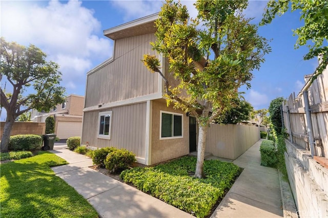 view of side of home with fence