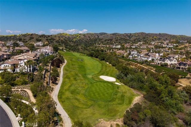 bird's eye view featuring a residential view, view of golf course, and a mountain view