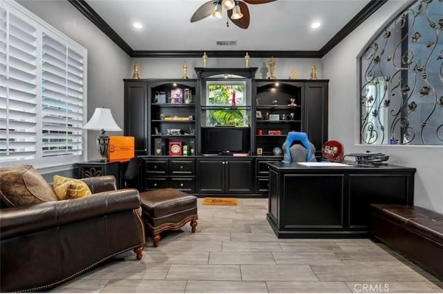 office with crown molding, ceiling fan, and visible vents