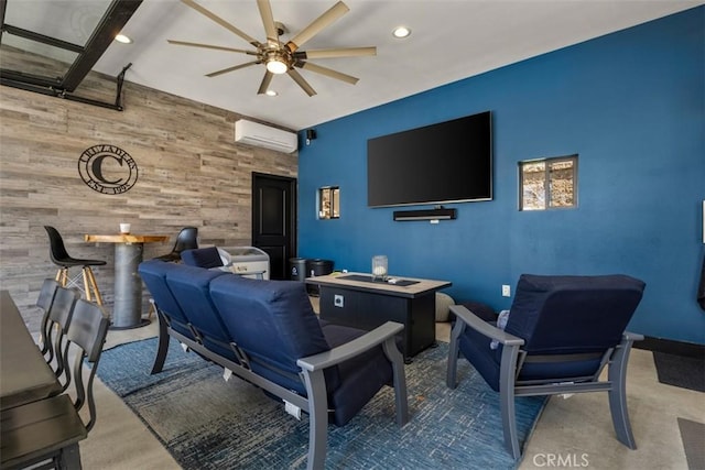 interior space featuring a ceiling fan, a wall mounted AC, wood walls, an accent wall, and recessed lighting