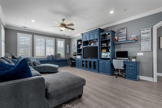 living area featuring a ceiling fan, visible vents, crown molding, baseboards, and light wood finished floors
