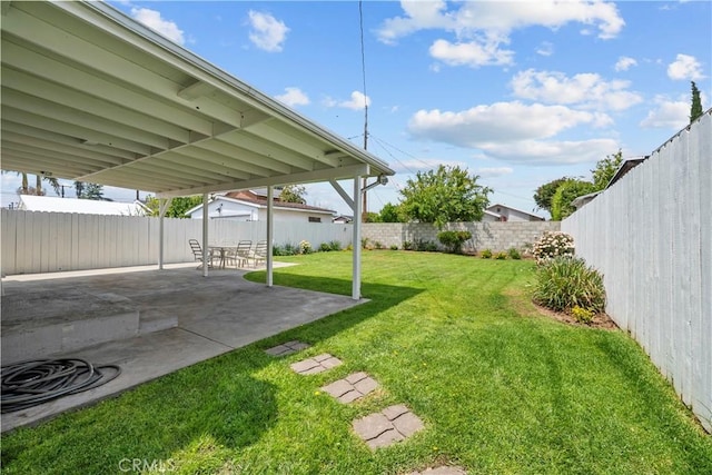 view of yard with a fenced backyard and a patio area
