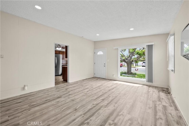 941 N Brand Blvd, San Fernando, CA 91340 - unfurnished living room featuring wood finished floors, a textured ceiling, ceiling fan, and recessed lighting