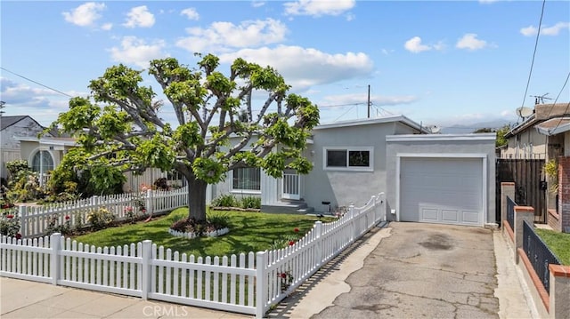 single story home featuring an attached garage, fence private yard, stucco siding, and aphalt driveway