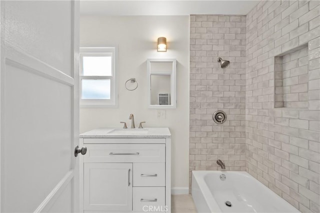 bathroom featuring shower / bath combination and vanity