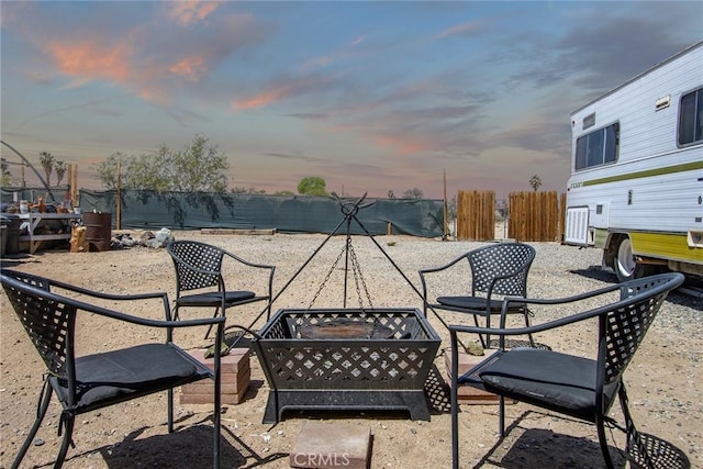 view of patio with a fenced backyard and an outdoor fire pit