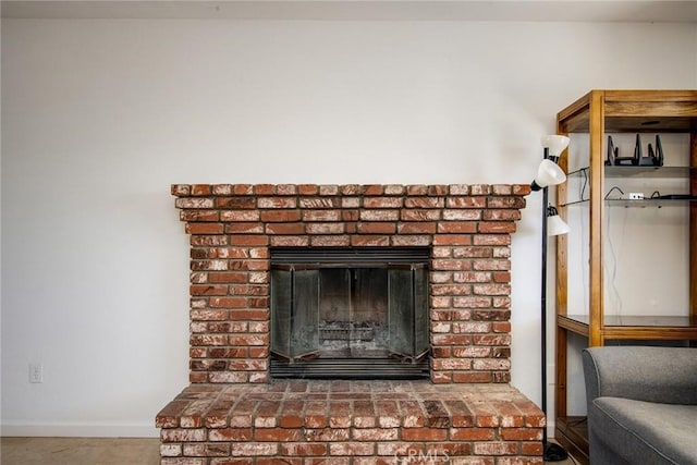 details with baseboards and a fireplace