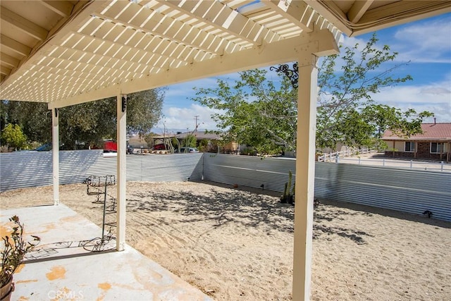 view of patio / terrace featuring fence and a pergola