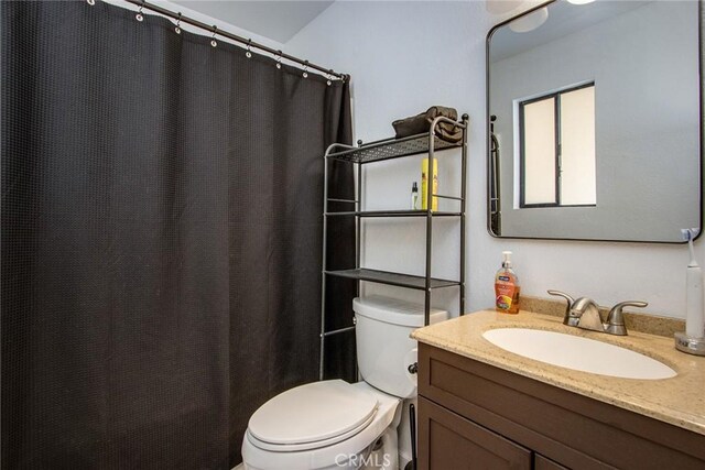 5750 Hall Ln Unit 29, Palms, CA 92277 - bathroom with vanity and curtained shower