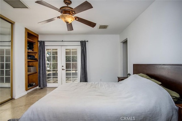bedroom with tile patterned floors, visible vents, access to exterior, and french doors