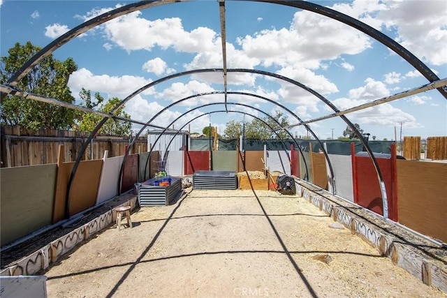 view of patio featuring fence