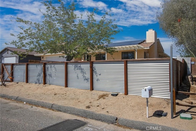 5750 Hall Ln Unit 29, Palms, CA 92277 - exterior space featuring solar panels and fence