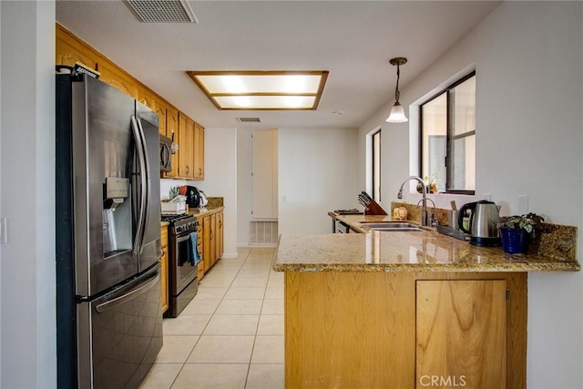kitchen with light tile patterned flooring, a sink, stainless steel appliances, a peninsula, and visible vents