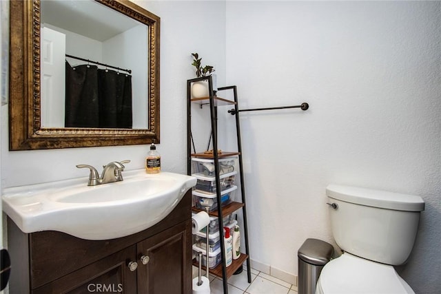 full bath with vanity, tile patterned floors, and toilet