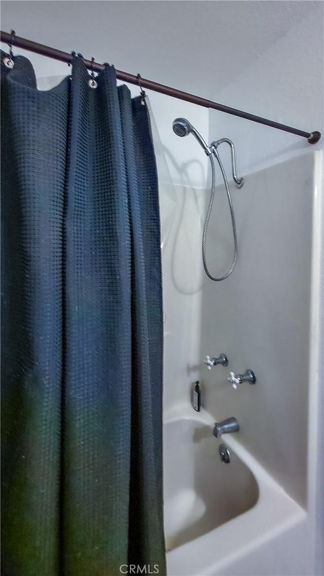 bathroom with shower / tub combo