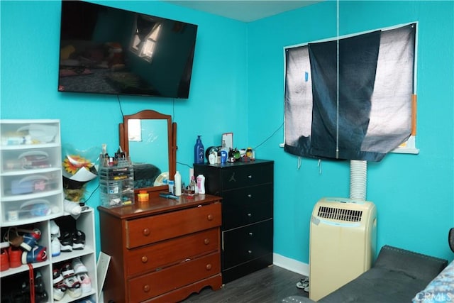 bedroom featuring dark wood finished floors