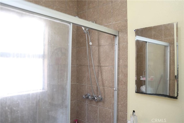 full bathroom featuring a stall shower